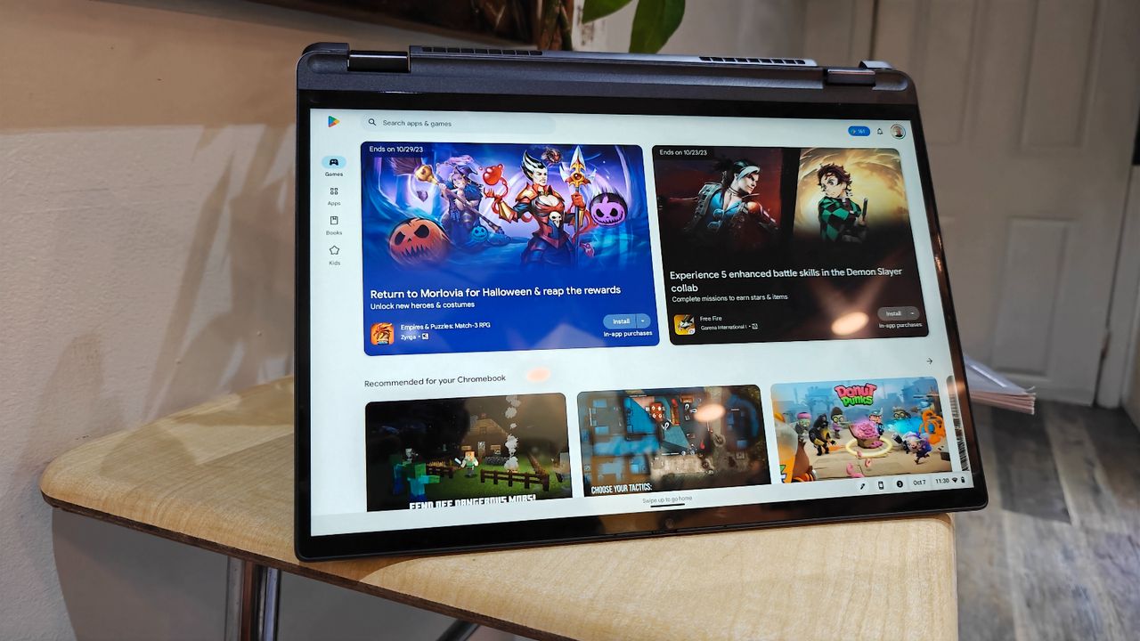 Lenovo IdeaPad Flex 5i Chromebook Plus open in "tent mode" on a wooden desk