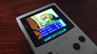 Game Boy Color AMOLED screen with OSD menu displayed over Zelda: Oracle of Seasons intro