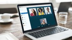 A laptop in an office displaying Microsoft video conference software