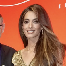 amal clooney wears a gold sequin gown at the cartier awards 
