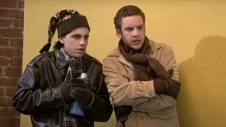 Rider Strong and Ben Savage looking cold while standing on a billboard on Boy Meets World