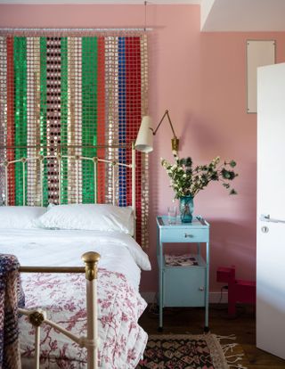 Pink bedroom with shimmering wall hanging
