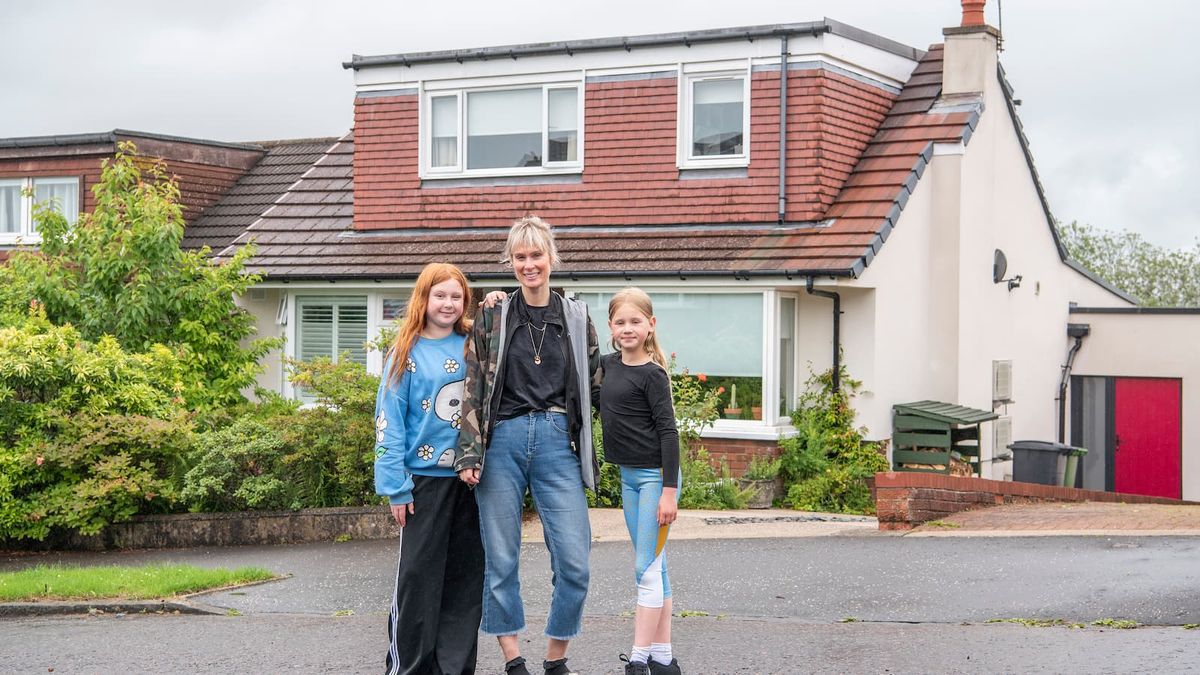 A 1960s bungalow extension in Milngavie with a mother and two children standing in front of it