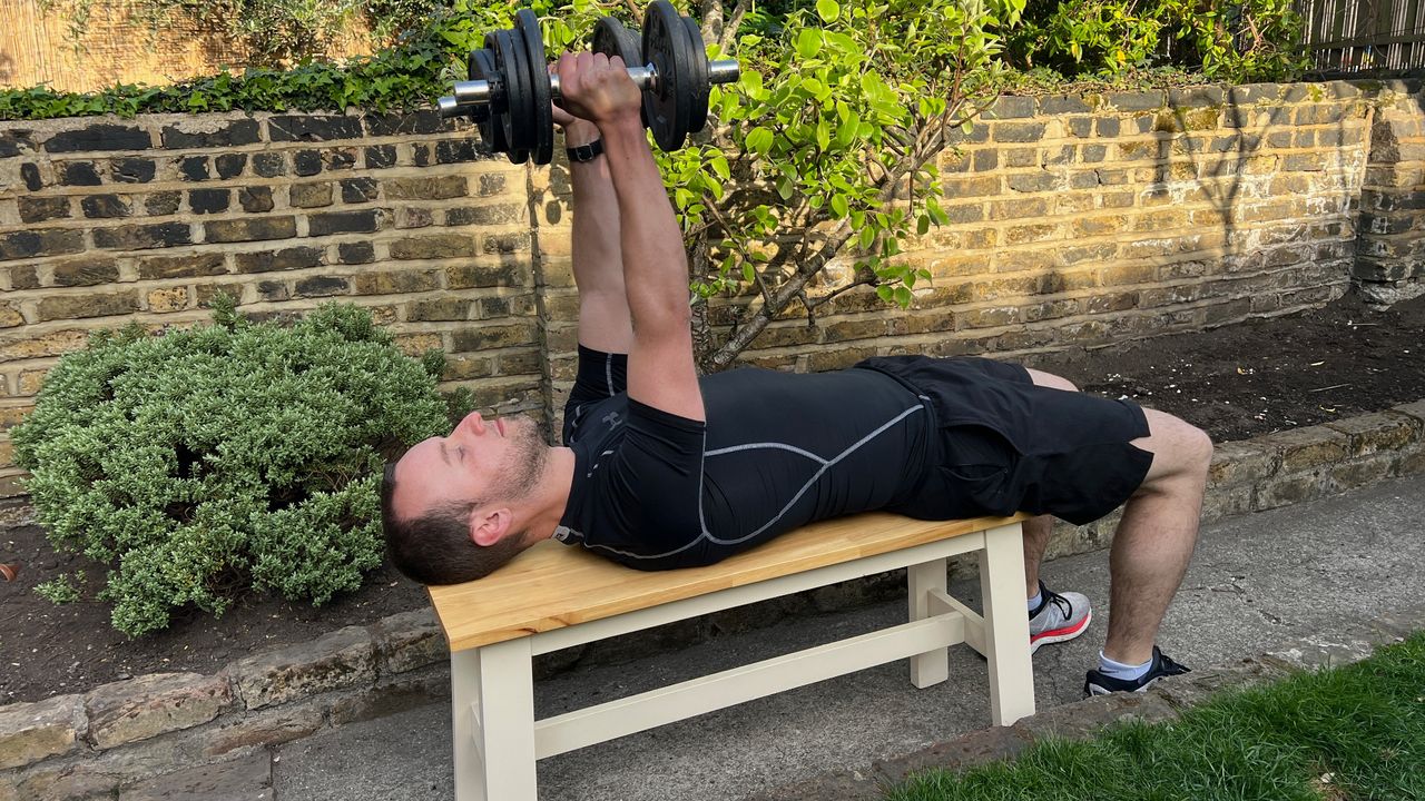 Man exercising with dumbbells