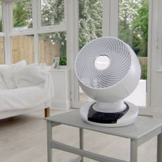 The MeacoFan 1056 Air Circulator sat on a table in a white conservatory
