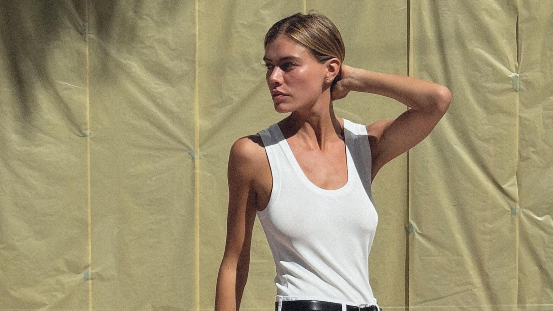 woman wearing a white Zara tank top. 