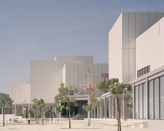Exterior of the Jameel Arts Centre with trees and seating