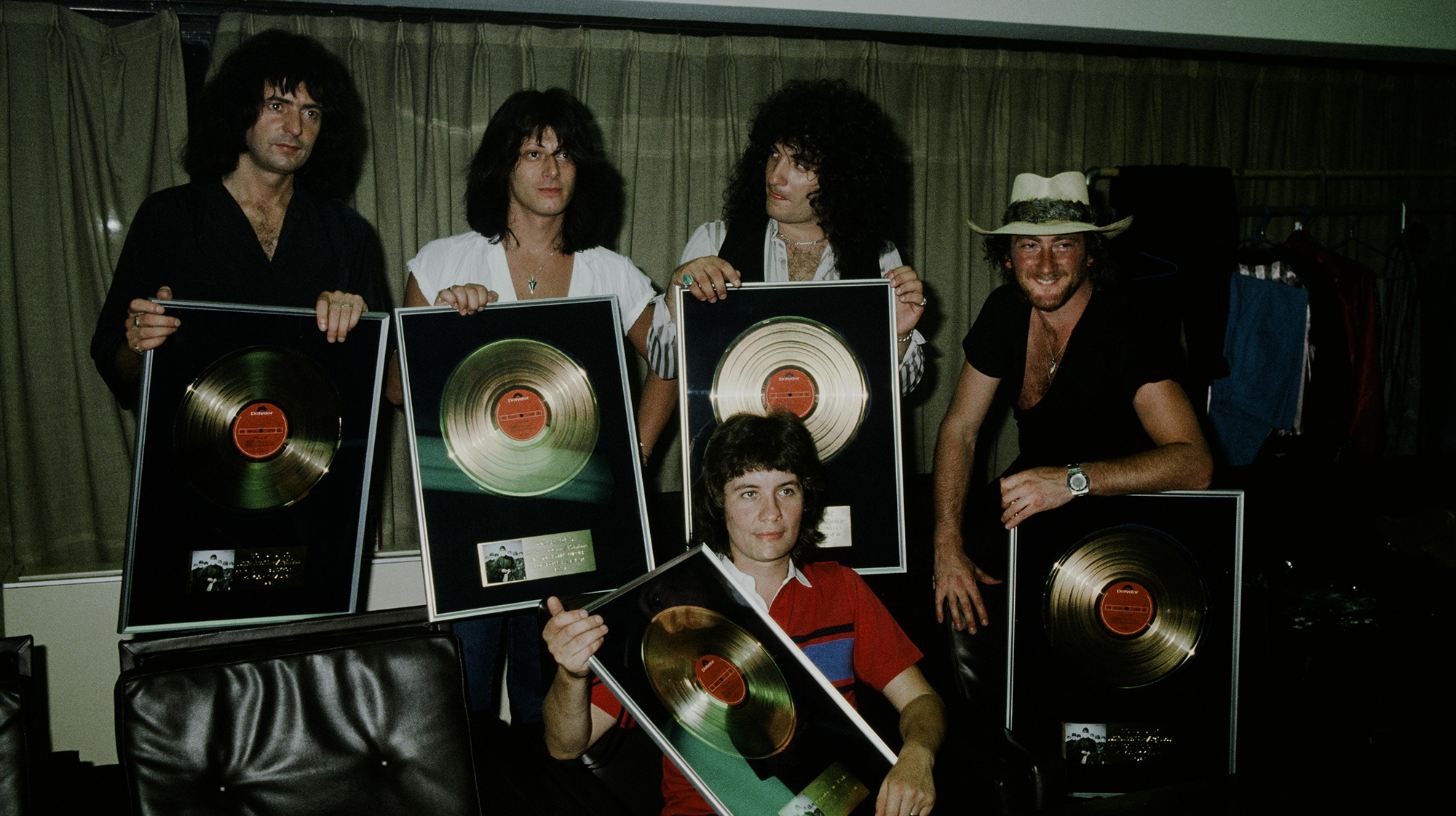 Rainbow are presented gold disc for 'Difficult to Cure', Tokyo, August 1981. (from left) Ritchie Blackmore, joe Lynn Turner, Bobby Rondinelli, Roger Glover and (at front) Don Airey.