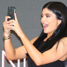 Hair, Beauty, Black hair, Arm, Long hair, Photography, Muscle, Selfie, Electronic device, Brown hair, 