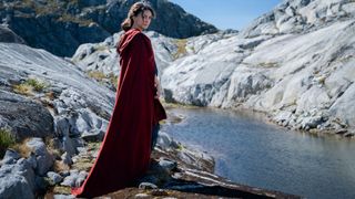 Bronwyn (Nazanin Boniadi) stands next to a lake in The Rings of Power