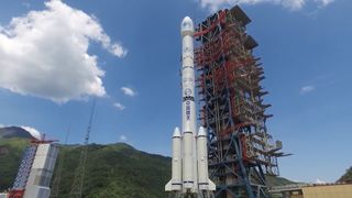 A Long March 3B rocket stands upright on a launch pad at the Xichang space base.