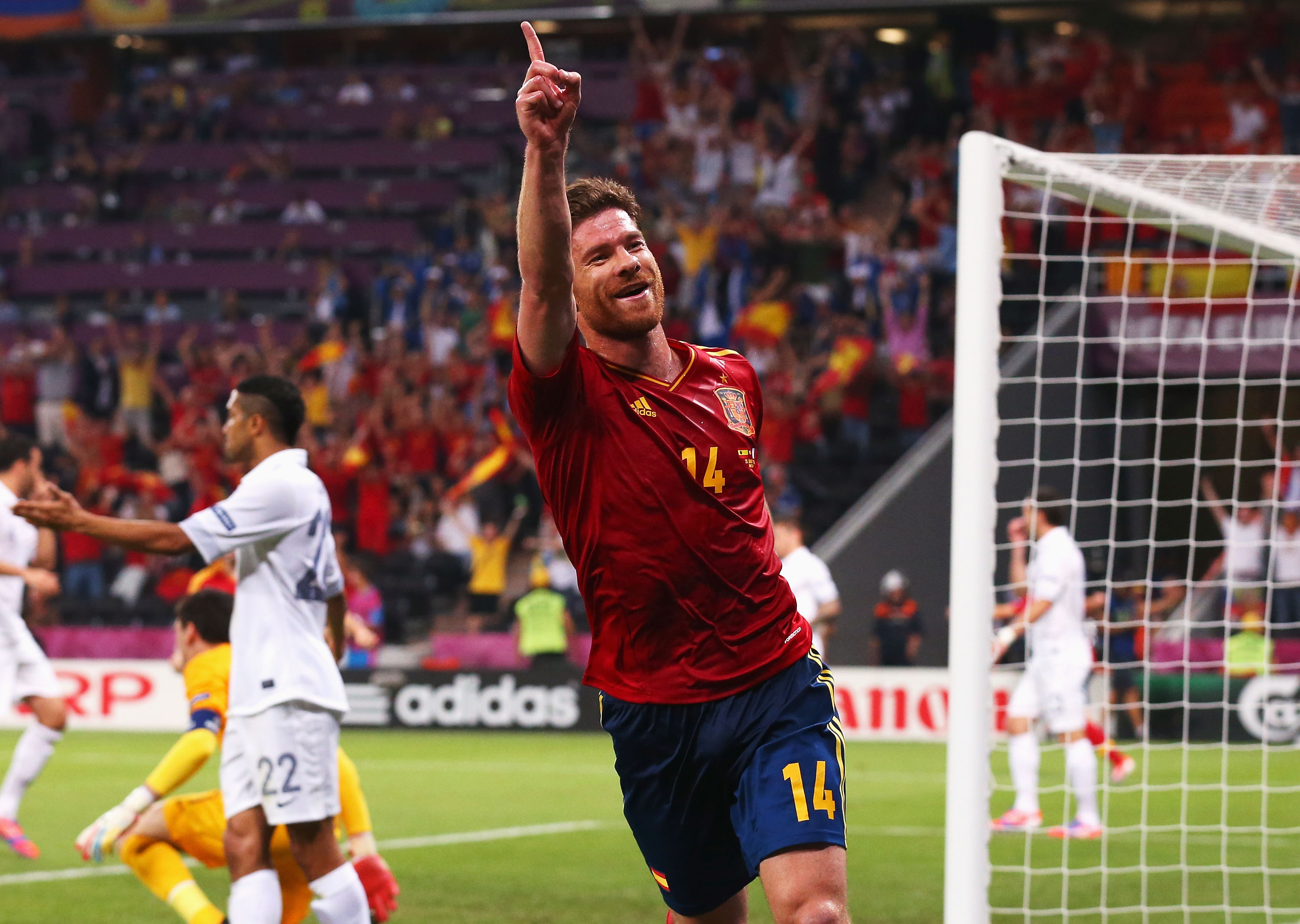 Xabi Alonso celebrates after scoring for Spain against France at Euro 2012.