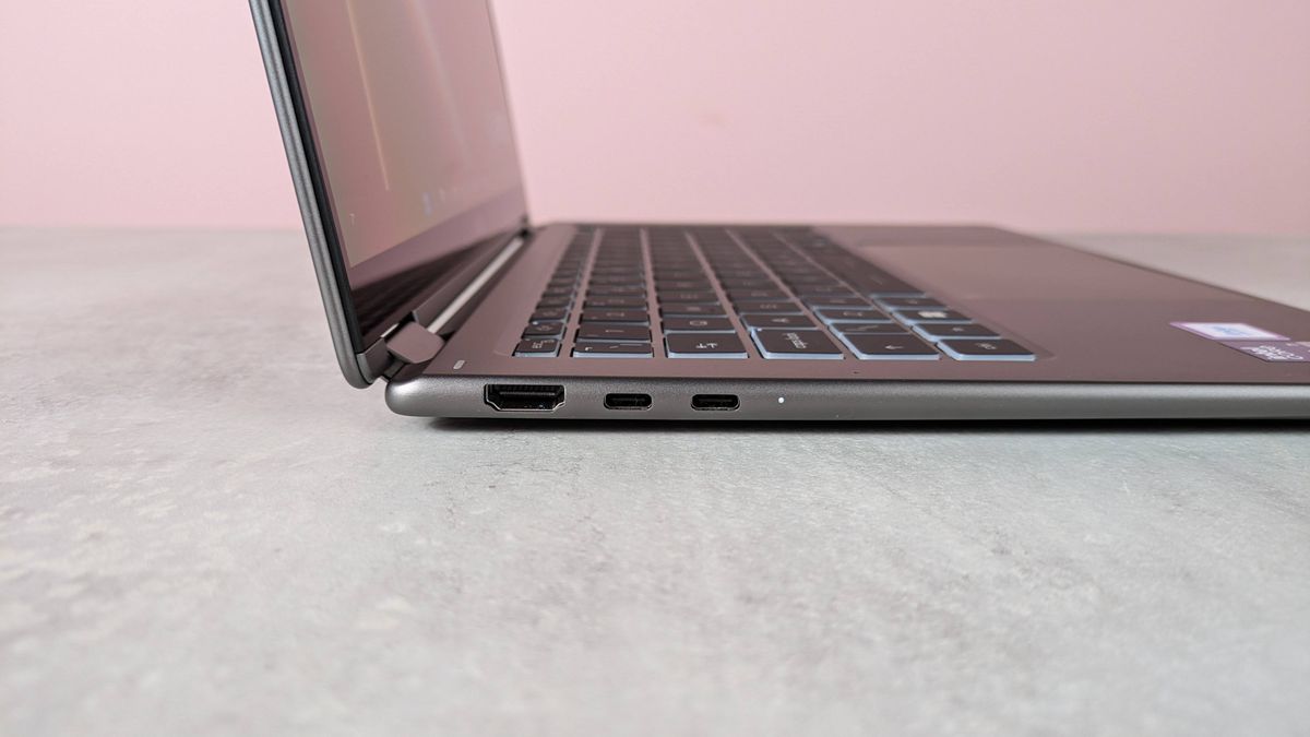 Close-up of ports on left-hand side of MSI Prestige 14 Flip AI+, on a white desk with pink wall in background