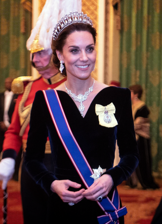 Catherine, Duchess of Cambridge talks to guests at an evening reception for members of the Diplomatic Corps at Buckingham Palace on December 11, 2019 in London, England