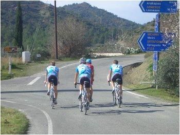 Team Milram riders train on Cyprus, surrounded by the Mediterranean Sea.