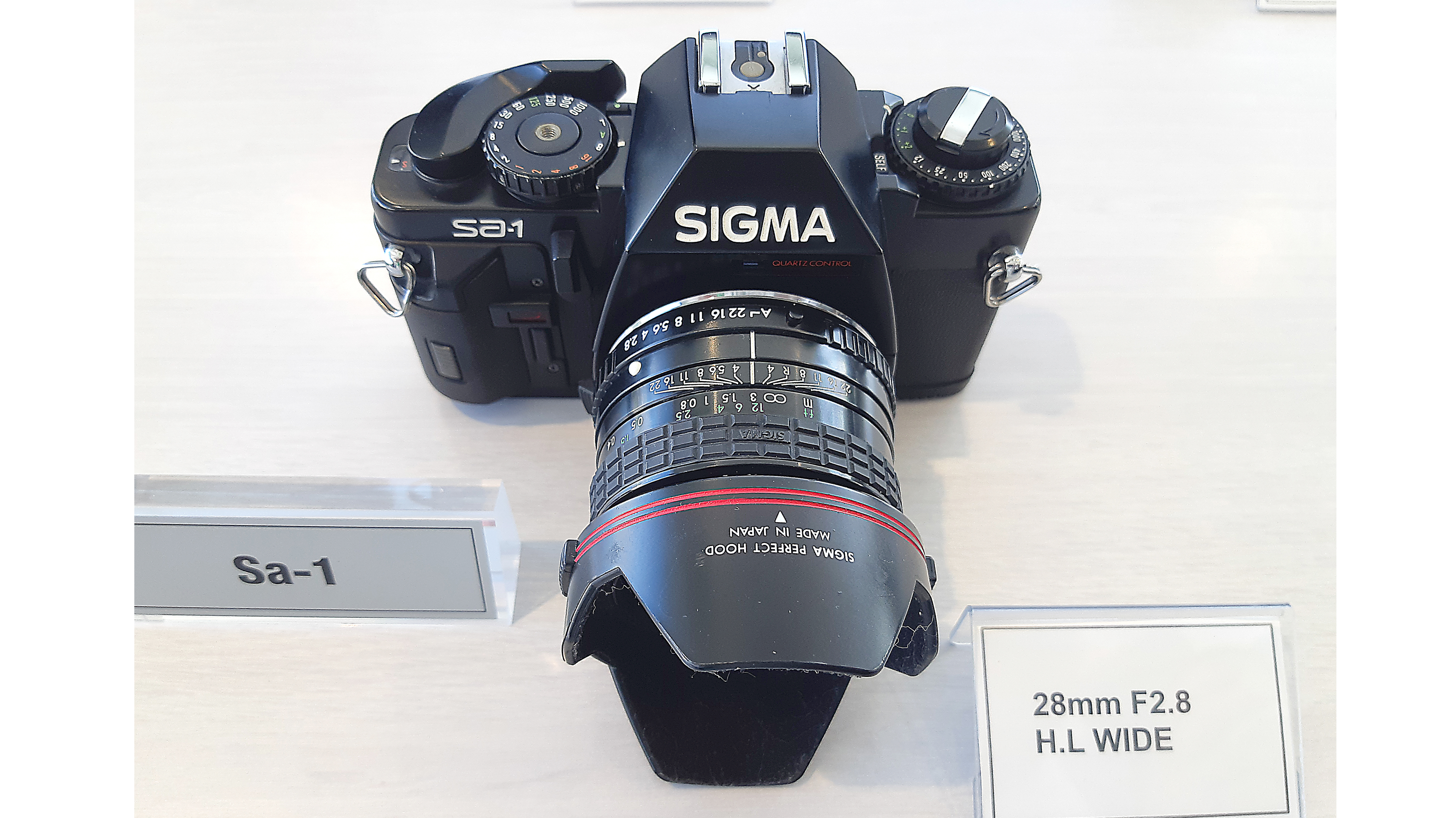 Sigma SA-1 (1983). K mount 35mm SLR based on the Ricoh XR7. Aperture-priority auto exposure control.