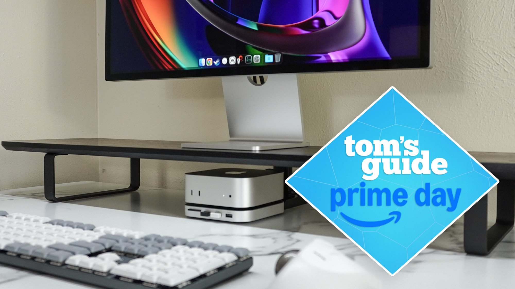 The Satechi SM3 mechanical keyboard with the Mac mini M4 with Satechi&#039;s USB hub and stand underneath it on a desk with a Tom&#039;s Guide Prime Day deals badge on top