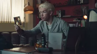 Will Poulter holding up a CD-ROM in Black Mirror