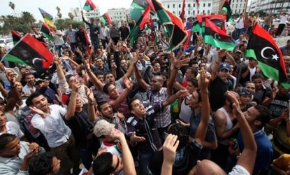 Libyans celebrate the death of Moammar Gadhafi Thursday in Tripoli