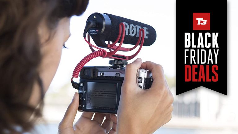 Person shooting a video using a DSLR and a RØDE VideoMic GO