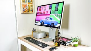 Mac Studio on desk plugged into Studio Display