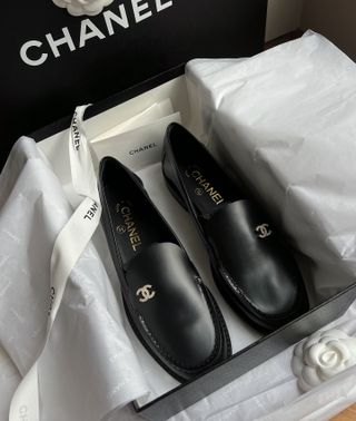 Chanel loafers in a box.