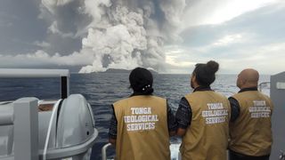 An image of Tonga Geological Services staff looking at the volcano eruption