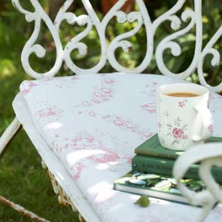 garden chair with floral fabric seat cover