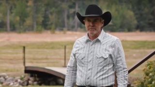 garrett standing on jamie's ranch in yellowstone