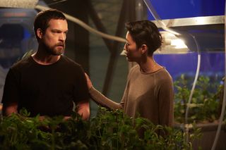John Light as Dr. Paul Richardson, the British exobotanist, left, and Jihae as Hana Seung, the Korean-American mission pilot and software engineer.