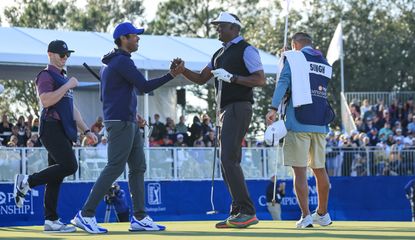 Vijay and Qass Singh shake hands after their victory