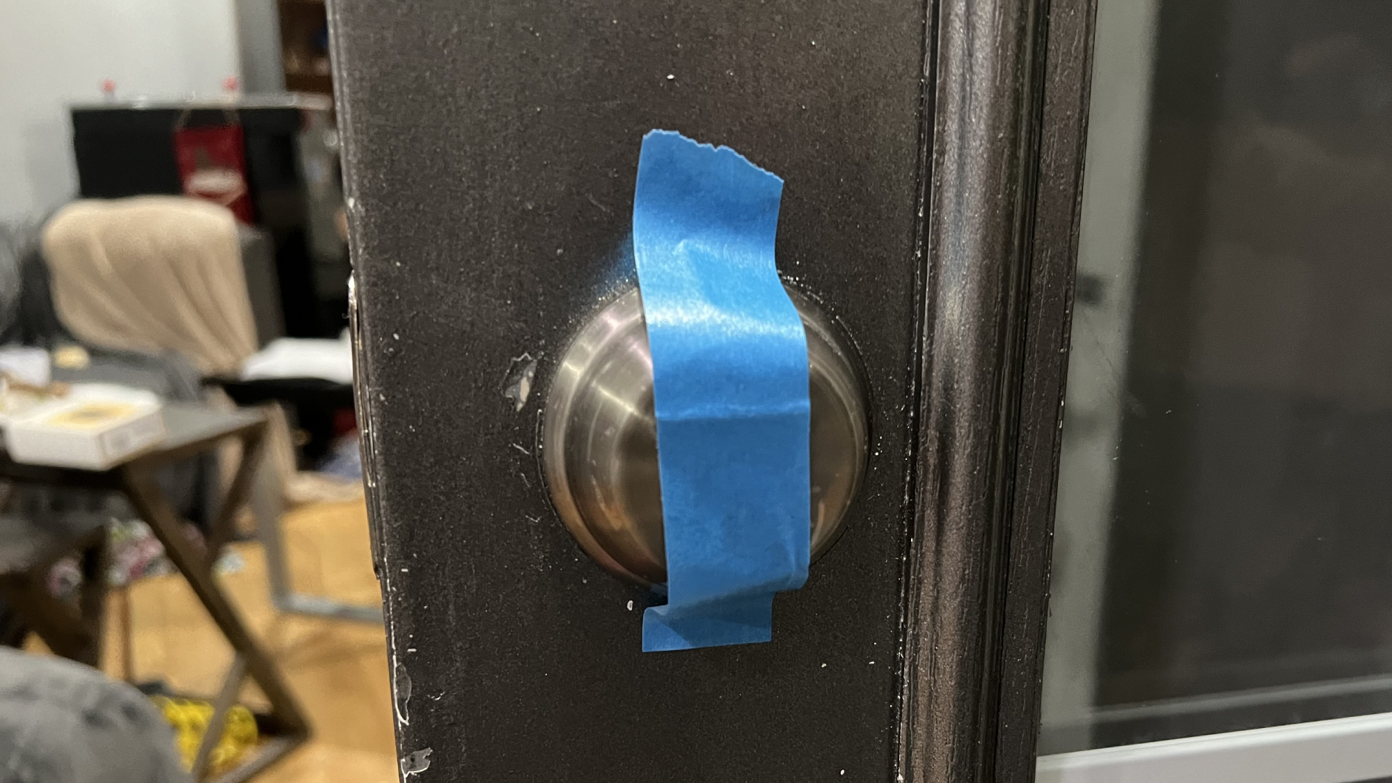 Tape over exterior lock to hold it in place