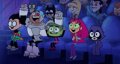 Robin, Cyborg, Beast Boy, Starfire, and Raven sit at a movie theater in the new Teen Titans Go movie