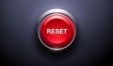A red reset button on a dark background, demonstrating the Mullilgan rule.