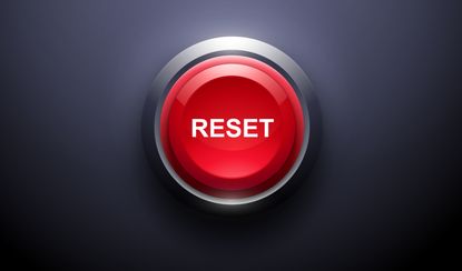 A red reset button on a dark background, demonstrating the Mullilgan rule.