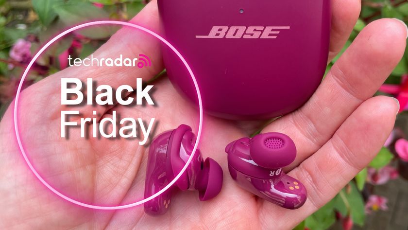 Bose QuietComfort Ultra Earbuds (2nd Gen) held in a hand with TechRadar&#039;s Black Friday branding