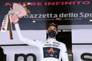 Filippo Ganna wears the white best young riders jersey at the Giro d'Italia 2021