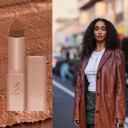 A woman wearing a brown trench coat next to a bronzer stick