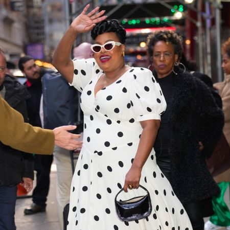 Natasha Rothwell wears a polka dot dress by Reformation 