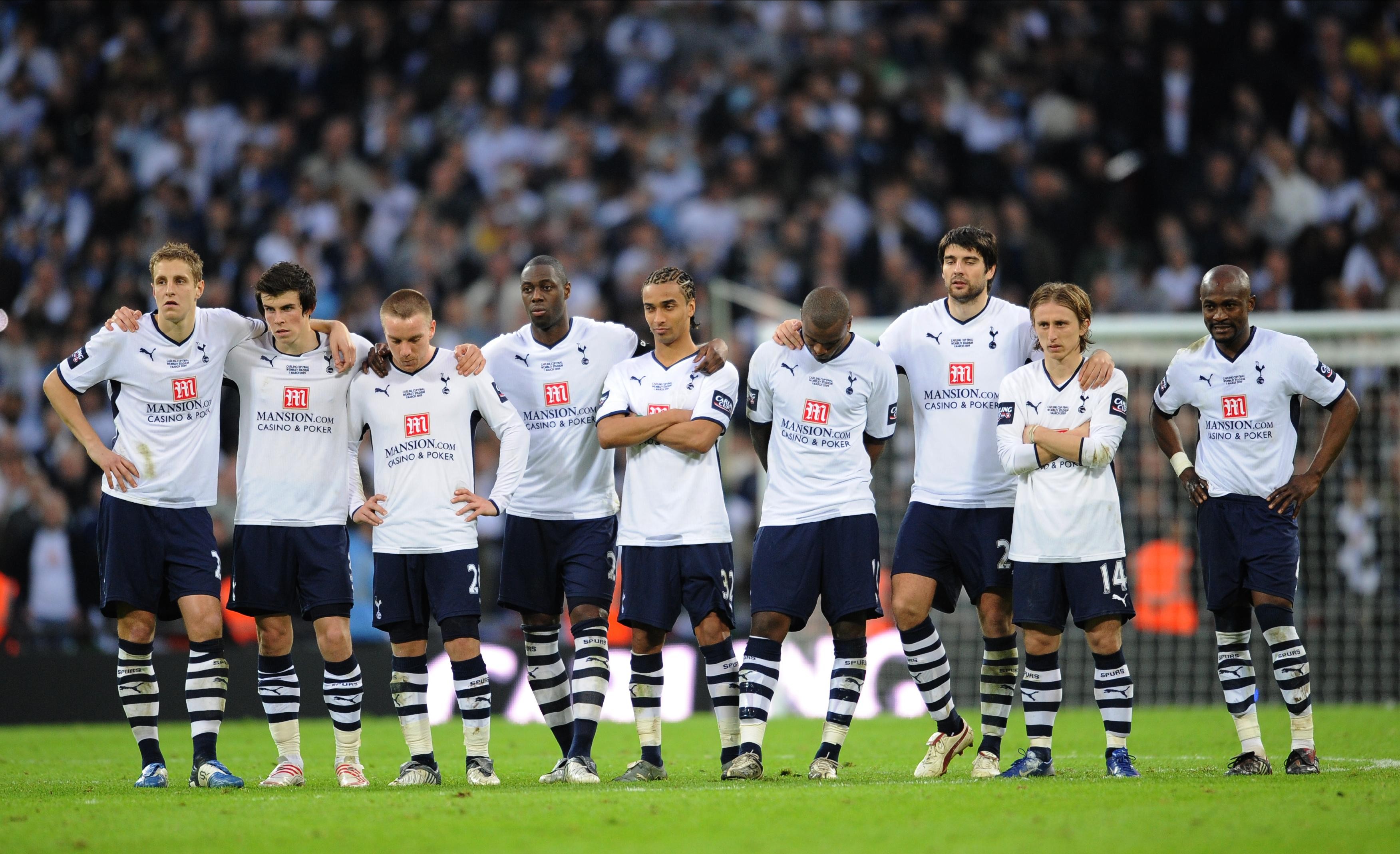 Tottenham players watch on during their team's penalty shootout defeat to Manchester United in the 2009 League Cup final.