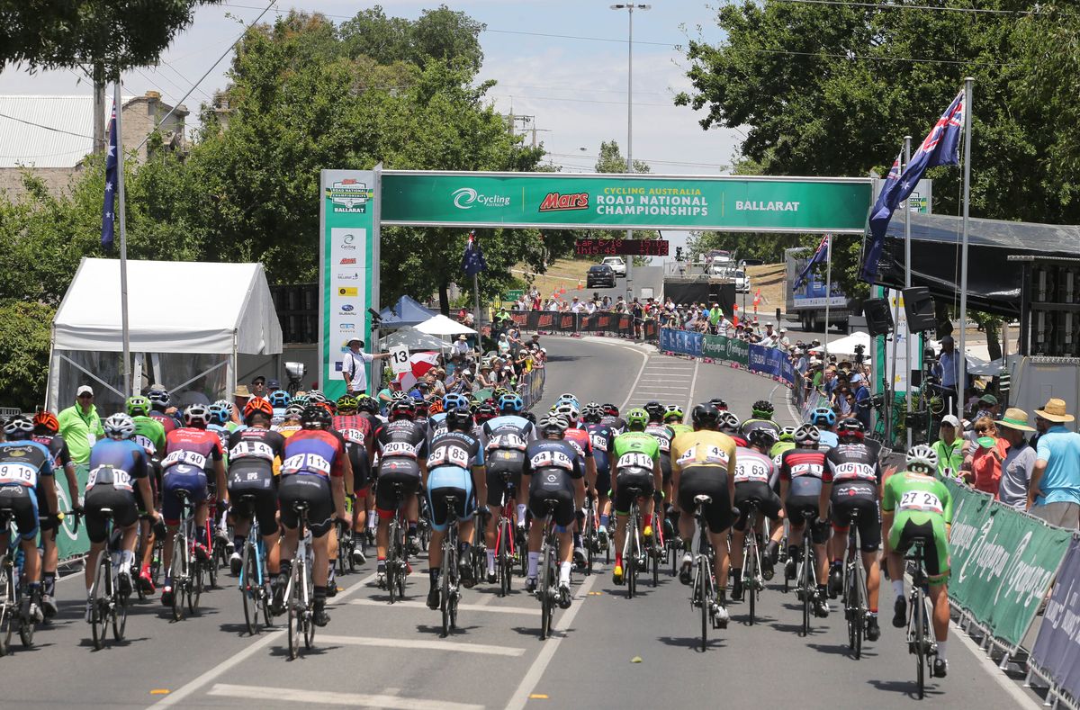 The riders pass through the finish line for another lap