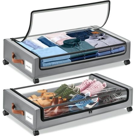 Two grey fabric storage bags for under the bed, on black plastic wheels with clear lids. Shoes in the bottom bag, and folded shirts in the top bag.