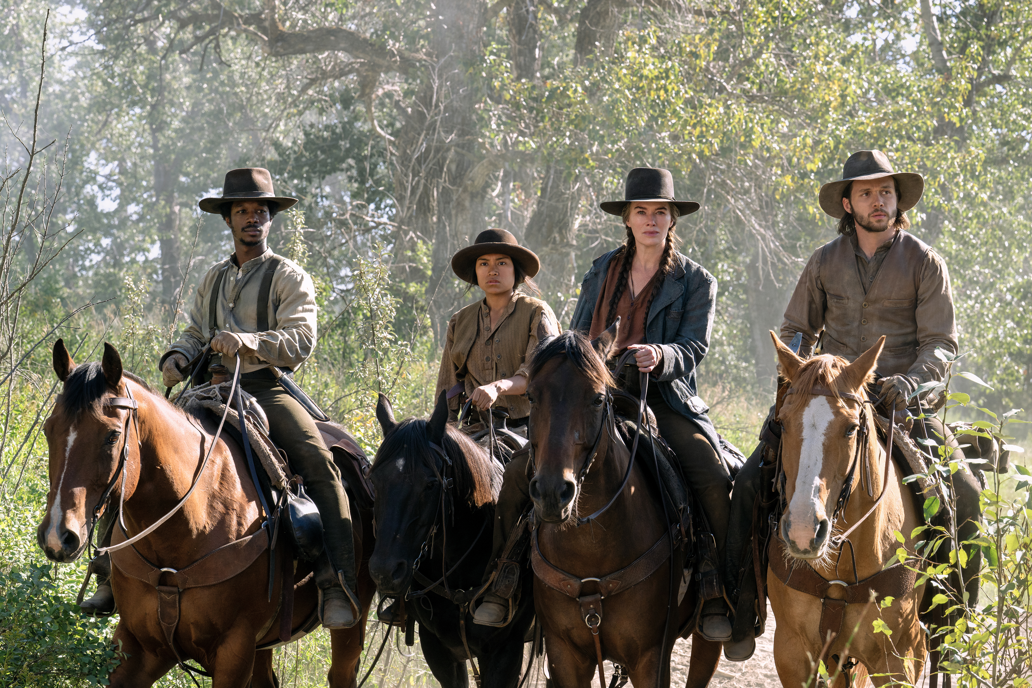 Lamar Johnson as Albert, Natalia del Riego as Lilla, lena headey as fiona nola, and nick robinson as elias riding on horses through the woods in the abandons