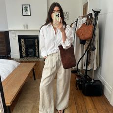 Tops that go with wide-leg trousers: @theannaedit wears a white shirt with wide-leg trousers