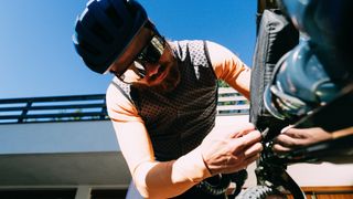 BikePerfect tech writer Graham Cottingham inspects a test bike