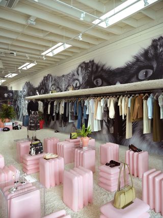 Tory Burch Melrose Store with pink plinths and cat wallpaper