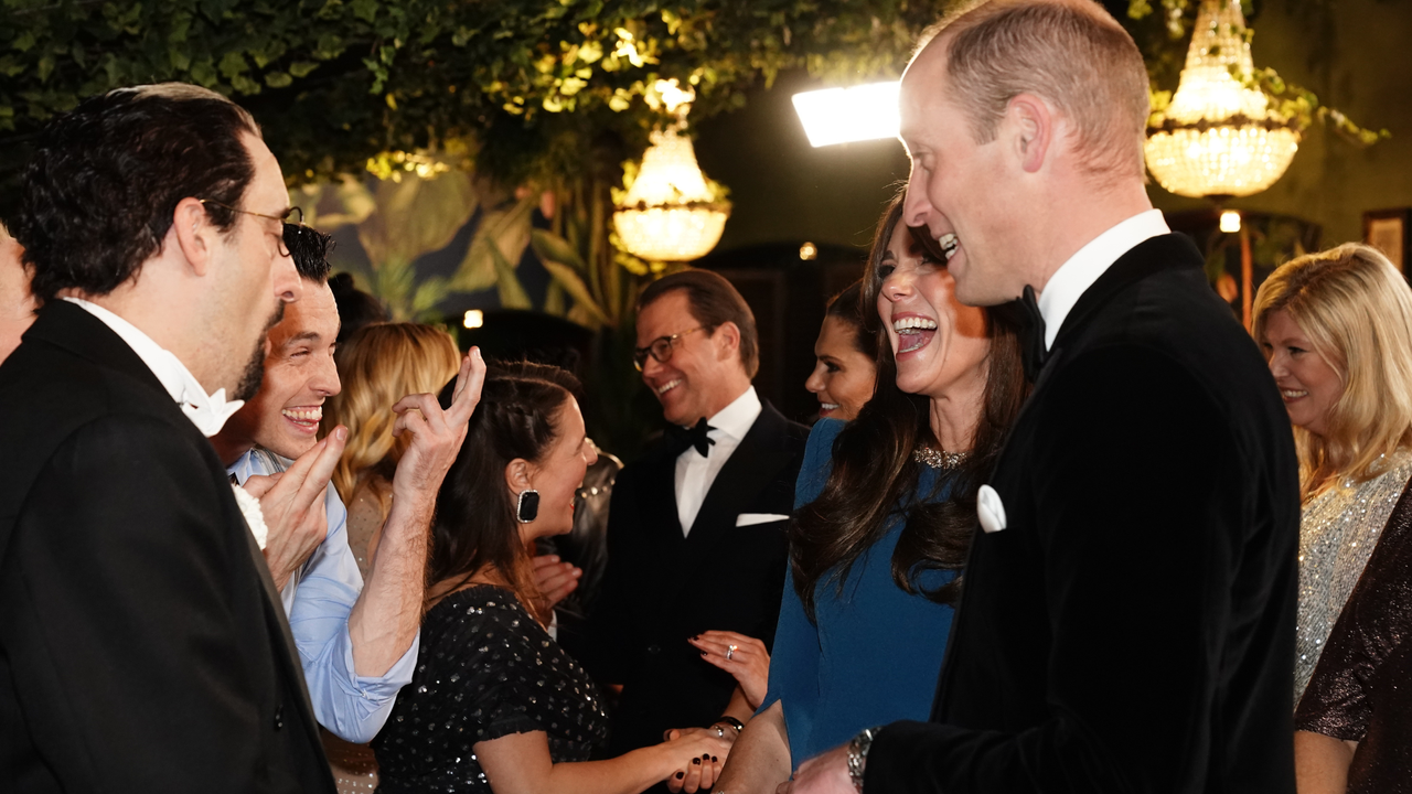 Catherine, Princess of Wales and Prince William, Prince of Wales speak with performers during the Royal Variety Performance at the Royal Albert Hall on November 30, 2023 in London, England.