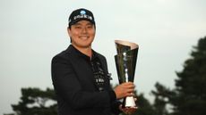 Junghwan Lee poses with the Genesis Championship trophy after winning in 2025