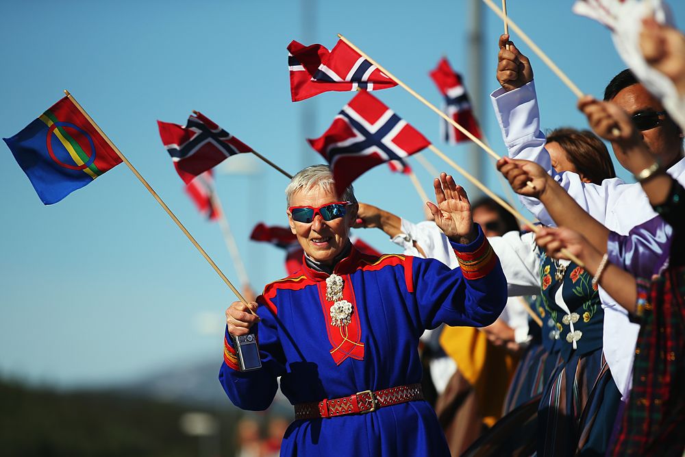 Norwegian fans line the streets waving flags during stage 3