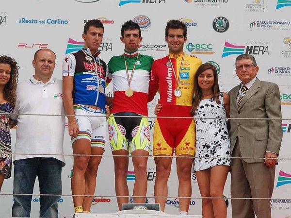 Alfredo Balloni tops the under 23 time trial podium with Adriano Malori and Alessandro Stocco, l &amp; r.